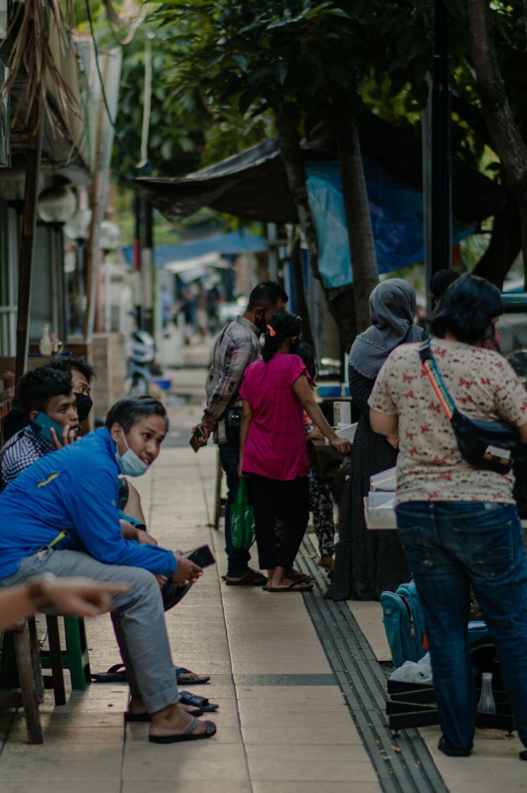 people using smartphones in public